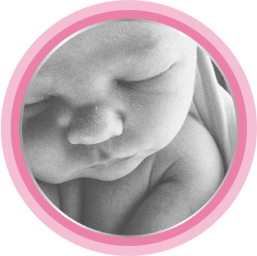 With newborn cream applied, baby sleeps soundly in the blanket.