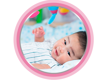 Happy baby in bed