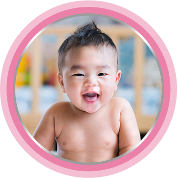 Baby smiling after nappy cream was applied.