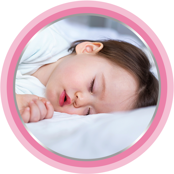 Newborn sleeping in bed. Baby cream helps!